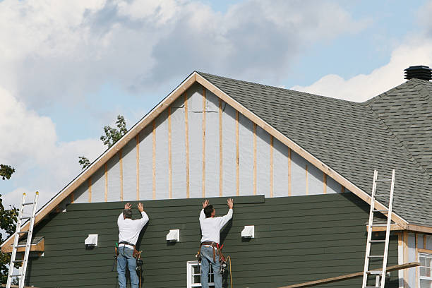 Professional Emergency Siding Repair technician working in Larimer, PA
